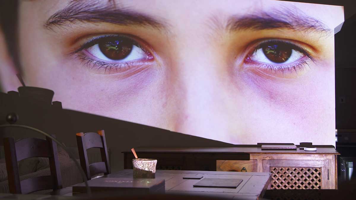 Childs eyes projected on to a wall