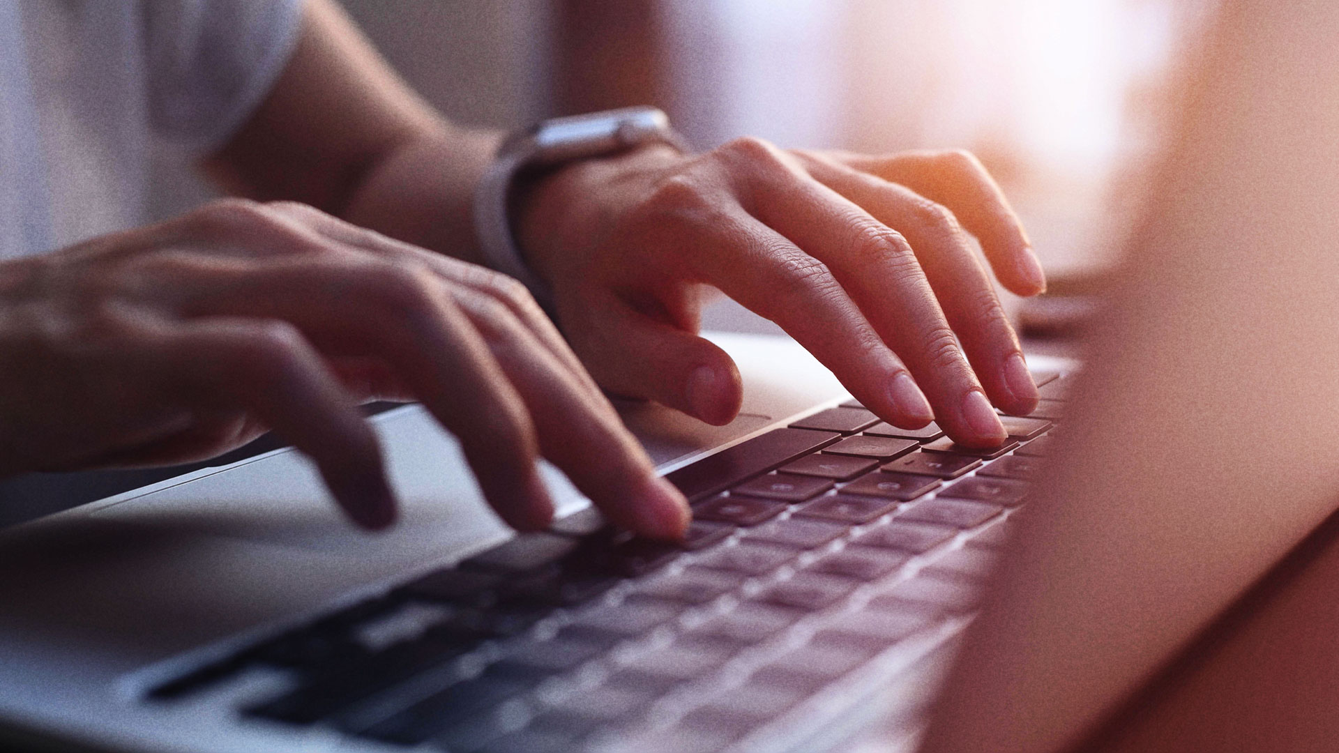 Woman typing on computer